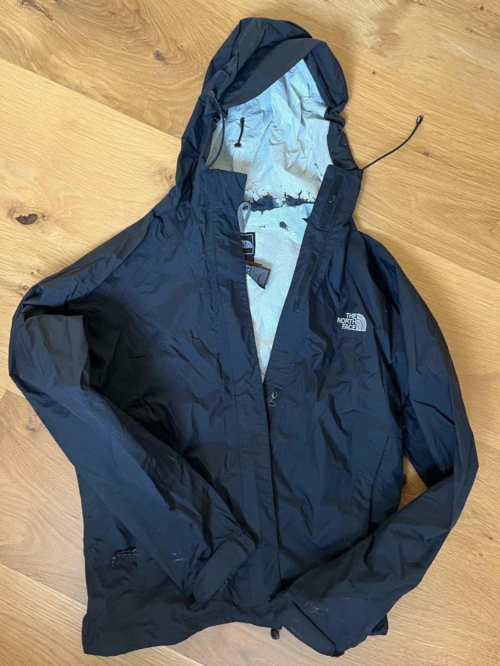 The North Face women’s Black Hooded Rain Shell Jacket